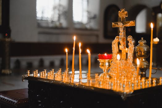 A serene church scene with lit candles and a golden crucifix, highlighting spiritual ambiance.